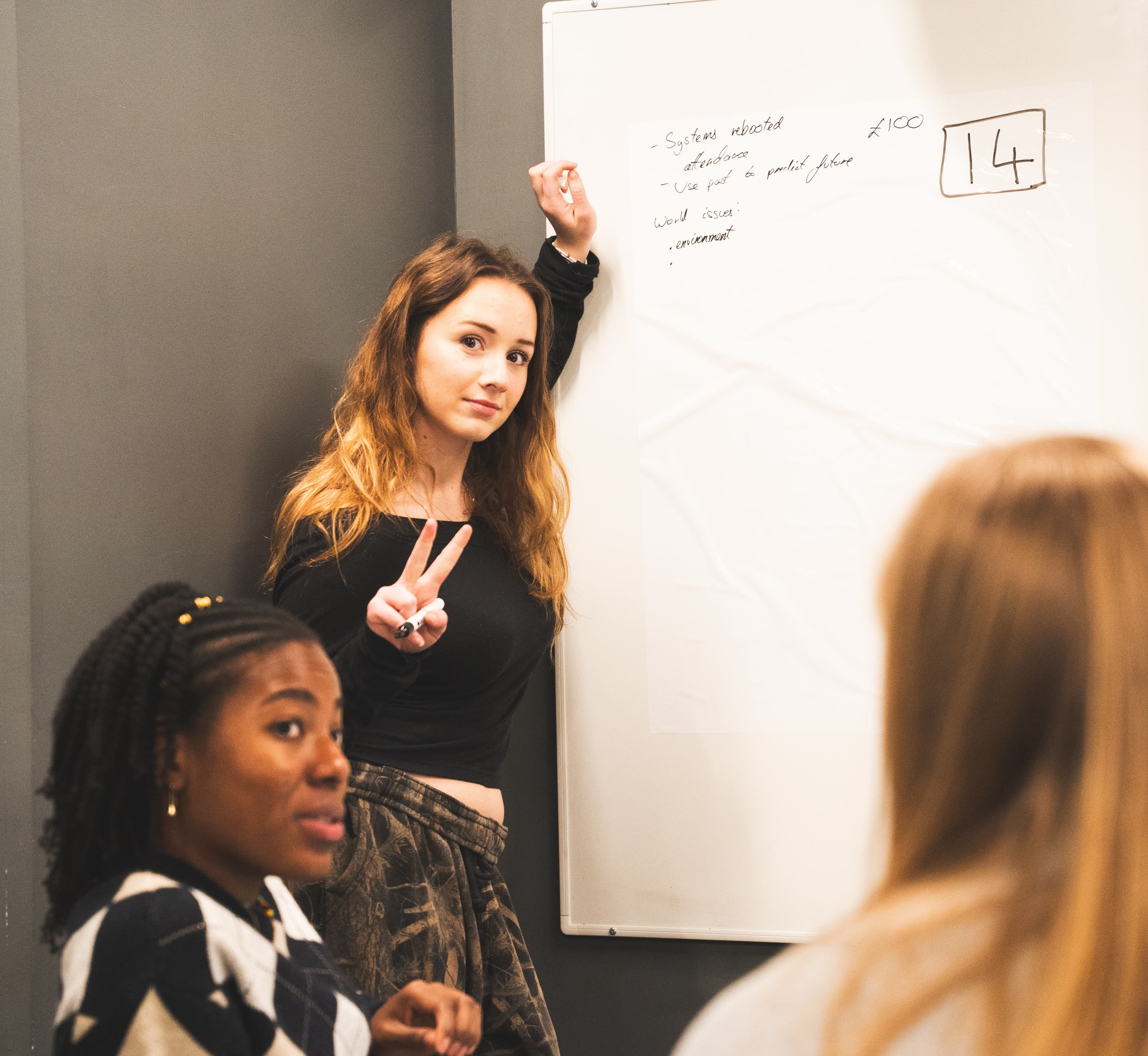 Attendees showing their work to a judge at LeedsHack 2025